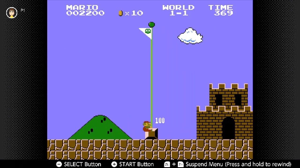 Mario pulling down the flagpole at the end of World 1-1